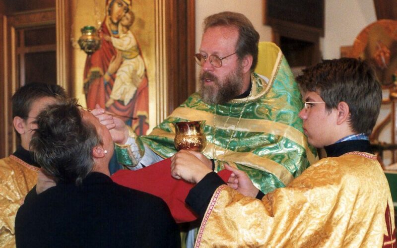 BYZANTINE PRIEST GIVES COMMUNION AT DENVER PARISH
