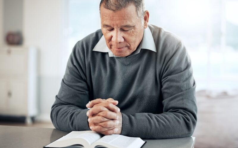 man prays